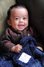 Mr. Airon Romeo snuggling with his denim chenille blanket