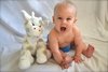 Connor is all smiles with his favorite Little G plush toy!