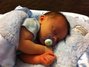 Everett 2 weeks old and loving his Little Giraffe blanket!