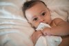 Jacob on his 6 month birthday with his Little Giraffe blanket